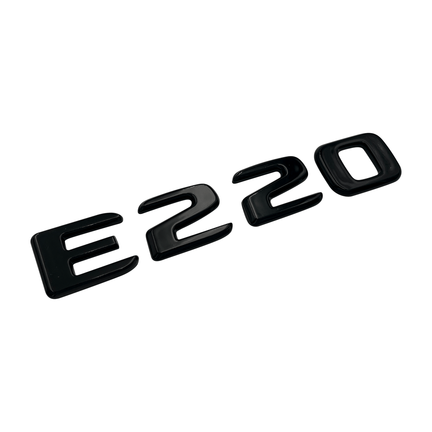 Svart Mercedes E220-emblem
